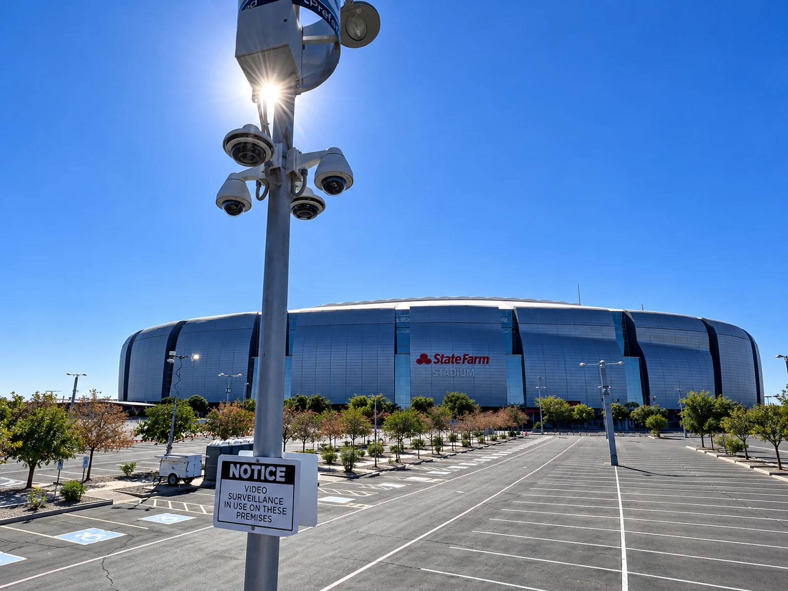 Pole with security cameras covering a stadium parking lot